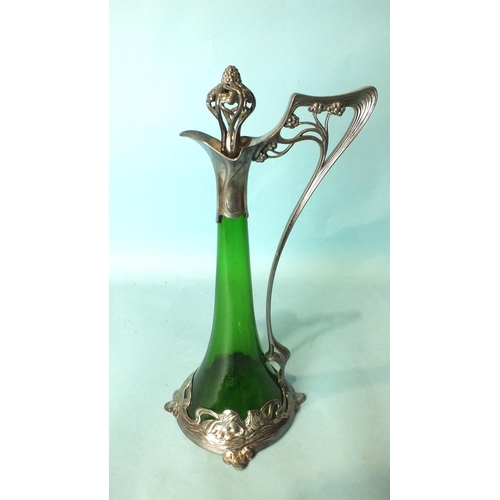 215 - A WMF Claret jug, the trumpet-shaped green glass body within the plated frame and whiplash handle an... 