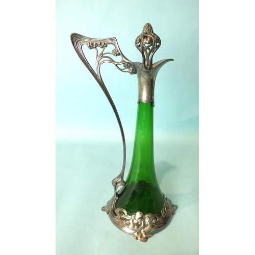 215 - A WMF Claret jug, the trumpet-shaped green glass body within the plated frame and whiplash handle an... 