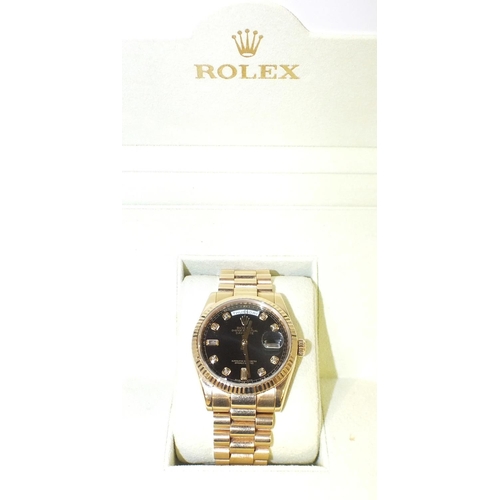 256 - A gentleman's 18ct gold Rolex Oyster Day-Date wrist watch c2008, the fluted bezel enclosing a black ... 