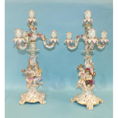 216 - A pair of 19th century Meissen porcelain three-branch candelabra representing Winter and Autumn, eac... 