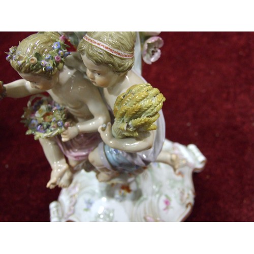 216 - A pair of 19th century Meissen porcelain three-branch candelabra representing Winter and Autumn, eac... 