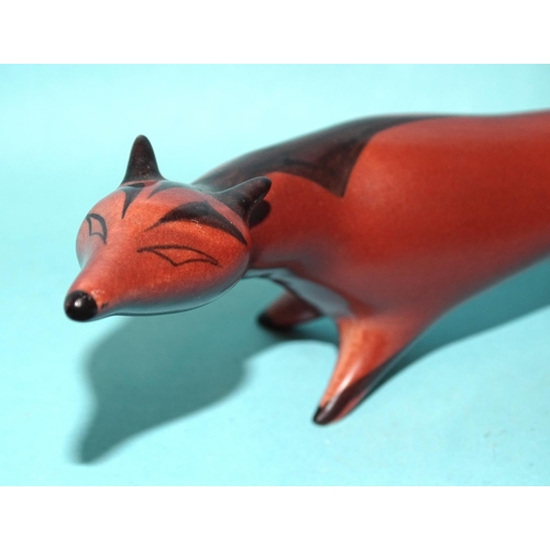 A Beswick stylised fox model no.1418, brown/black gloss, designed by Colin Melbourne, 21cm long.