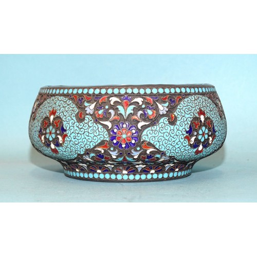 A 19th/20th century Russian cloisonné enamel circular bowl decorated in blue, white and red enamels in a foliate design, 84 mark and indistinct maker's mark, 11cm diameter, 5.5cm high.