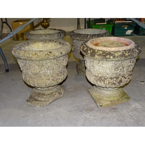 13 - A set of four cast concrete campana-shaped garden planters, 37cm diameter, 39cm high (one with ... 