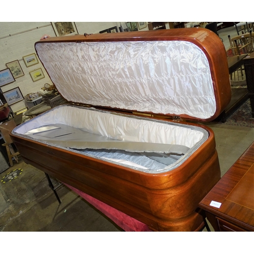 18 - Remaining Contents of a Funeral Director's Parlour.A large mahogany casket with hinged lid and zinc-... 