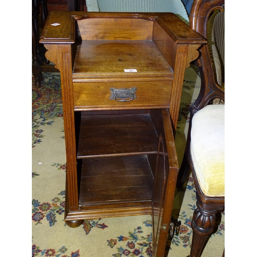 27 - An Edwardian walnut bedside cupboard fitted with a single drawer above a cupboard door, 48cm wide, 7... 