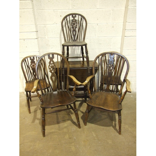 3 - A stained elm and beech wheel-back armchair, three similar side chairs and another armchair, an oak ... 