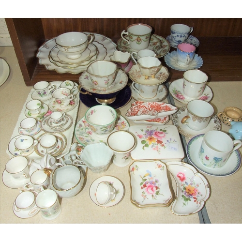 65 - A collection of modern miniature bone china cups, saucers and plates, various Crown Derby and other ... 