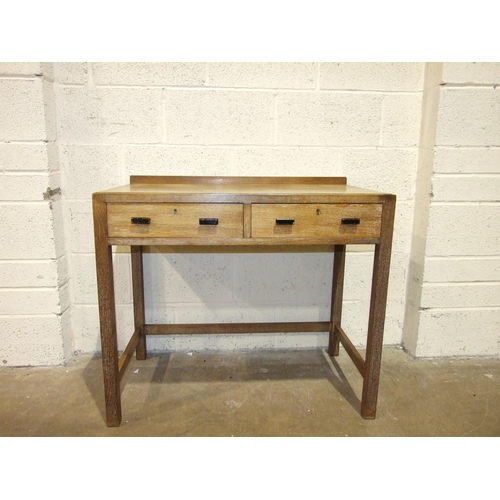 9 - A mid-20th century knee-hole dressing table with folding mirror and eight drawers, 107cm wide, a lim... 