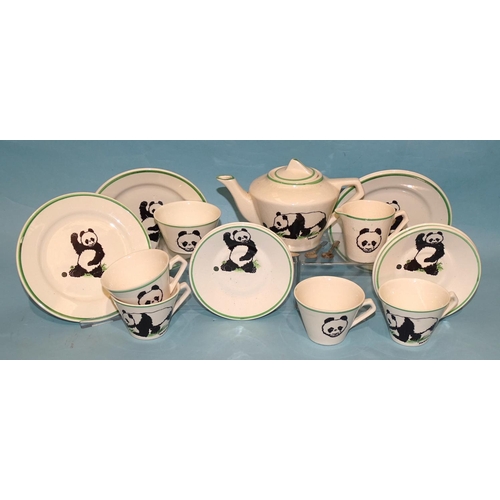A child's Wade Heath "Pandy" tea set decorated with a panda, comprising: teapot, sugar bowl, milk jug, four cups, four saucers, four side plates and four metal spoons.
