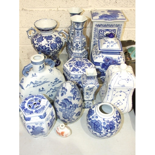 50 - A collection of modern blue and white Oriental ceramics, including vases, spice drawers, etc.... 