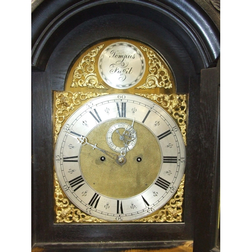 64 - A 19th century stained oak longcase clock, the carved case with arched brass dial, second subsidiary... 