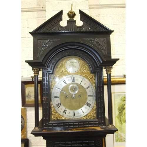 64 - A 19th century stained oak longcase clock, the carved case with arched brass dial, second subsidiary... 