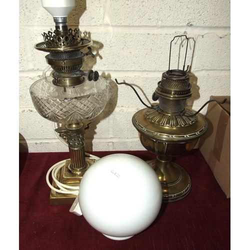 78 - A brass oil lamp in the form of a short Corinthian column candlestick, with cut-glass reservoir and ... 