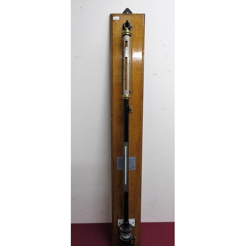465 - Negretti & Zambra of London stick barometer on golden oak wall plaque