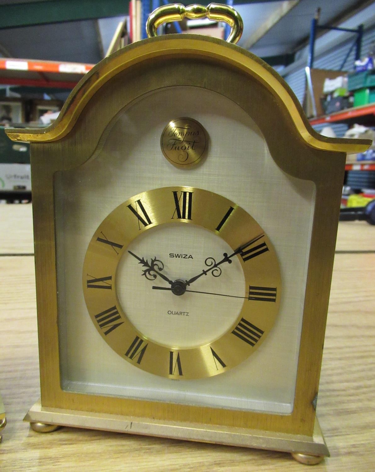 Swiza quartz carriage clock in lacquered brass case and a quartz