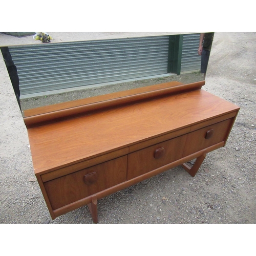 372 - Elliott's of Newbury teak dressing table, three drawers with rounded square handles on U-shaped supp... 