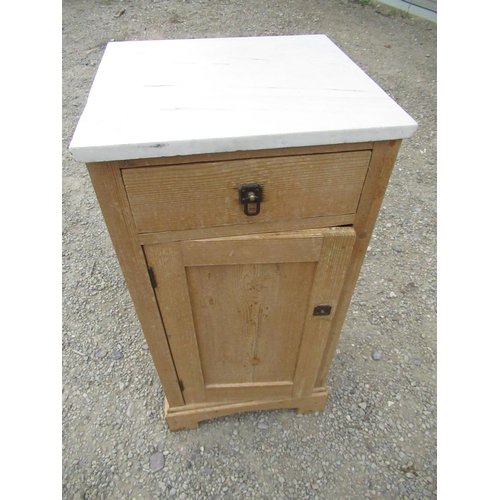374 - Small pine bedside cabinet with marble top and single drawer above a panelled door on bracket feet W... 