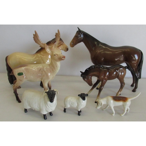 404 - Collection of Beswick animals including two horses, a foal, a stag, a sheep, a lamb and a dog (7)