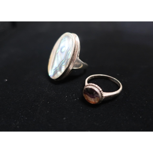 18 - Aberlone Mother of Pearl ring with silver mount stamped 925 Size M and another ring with amethyst ce... 
