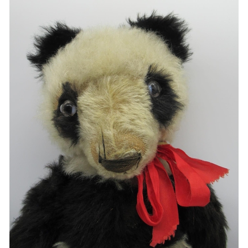 1 - Merrythought c. 1930's panda teddy bear in black and white mohair with clear glass eyes, jointed arm... 