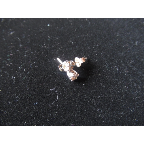 6 - Pair of white metal and diamond stud and post earrings with butterfly back fastening gross 1.2g