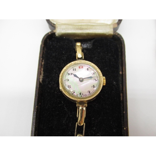 12 - 9ct gold Ladies wristwatch with hand wound Swiss made with mother of pearl dial, 15 jewel movement o... 