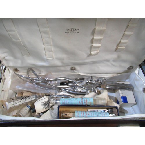 623 - Ede leather medical case, fitted interior containing forceps, syringes silkworm gut and other equipm... 
