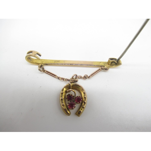 651 - Victorian 9ct rose gold bar brooch with three garnets mounted in horseshoe pendant suspended on a ch... 