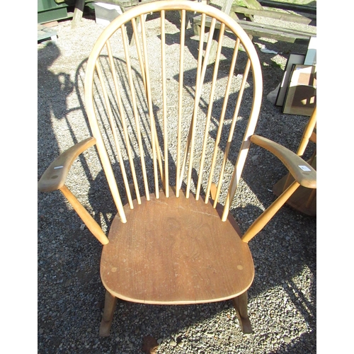 714 - Ercol light elm rocking chair, arched stick back and broad arms