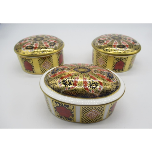 685 - Royal Crown Derby 1128 Old Imari pattern - pair of powder jars and covers, and similar oval box and ... 