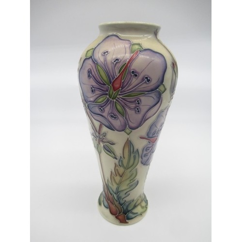 691 - Moorcroft pottery vase, the baluster body decorated with clematis pattern on an ivory ground, impres... 