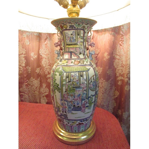 Pair of large Canton baluster shaped table lamps decorated in Famile