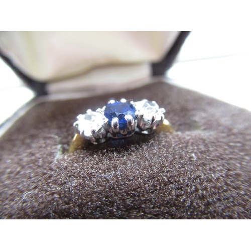 13 - C20th 18ct gold three stone Sapphire ring flanked by two diamonds Size J 1/2 gross 2.3g with certifi... 