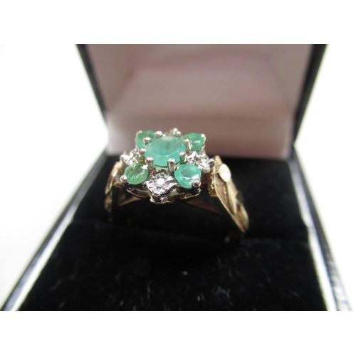 22 - 18ct gold diamond and emerald nine stone cluster ring with leaf formed shank Size O gross 4.9g