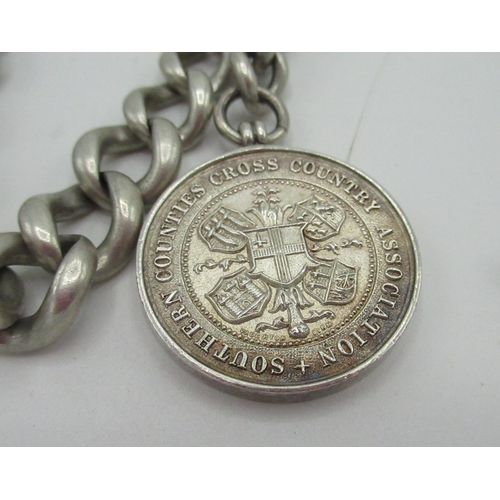 4 - Hallmarked Sterling silver graduated Albert chain with ‘Southern Counties Cross Country Association’... 