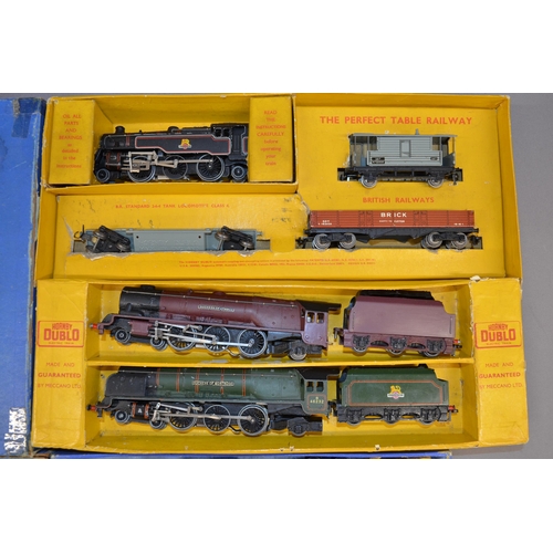 196 - 2 boxed Hornby Dublo electric train sets. 5 locomotives and a number of goods wagons and mobile cran... 