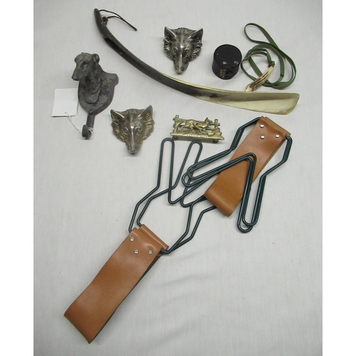 32 - Two game hangers with leather handles, dog head coat hook, horn whistle, shoehorn and other decorati... 