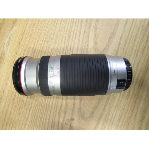 34 - Canon EOS 50, Tamron 28-200MM zoom lens, Casina 100-400 lens for Canon EOS, a pair of Swift Trilytes... 