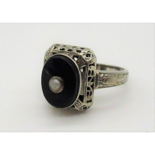 78 - 14ct white gold onyx and seed pearl ring stamped 14K, size J, 1/2 gross 2.8g