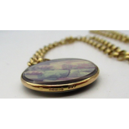 86 - Hallmarked 9ct yellow gold and glass locket pendant on a 9ct gold belcher chain with spring ring cla... 