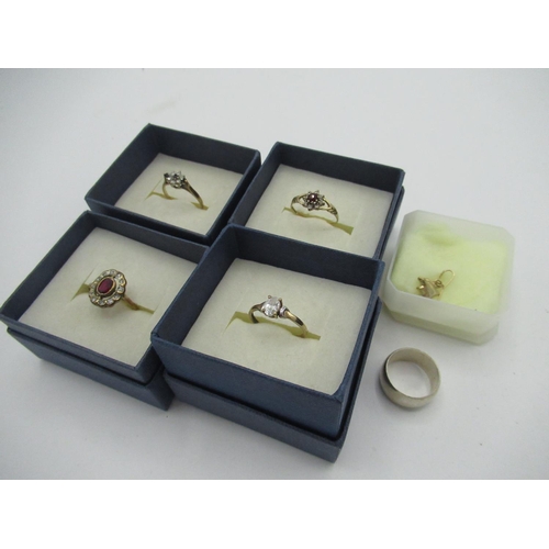 14 - Collection of 9ct gold rings set with white stones, garnets and sapphires, a hallmarked Sterling sil... 