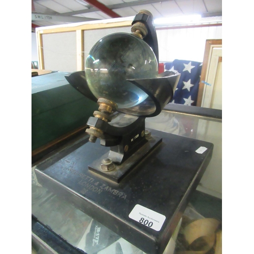 800 - Campbell-Stokes sunshine recorder by Negretti and Zambra with glass sphere in black metal mounts on ... 