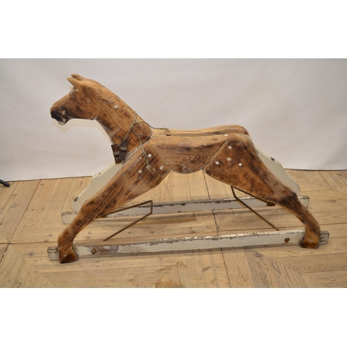 215 - Carved wood striped rocking horse figure with swing rocker type base, H79cm