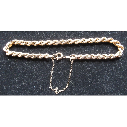 18 - 9ct yellow gold rope twist bracelet with safety chain and spring ring clasp stamped 9ct, L20cm, 4.8g