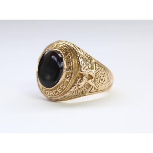 21 - Mid C20th US Airforce 10 carat gold fraternity type signet ring with central black onyx stone, flank... 
