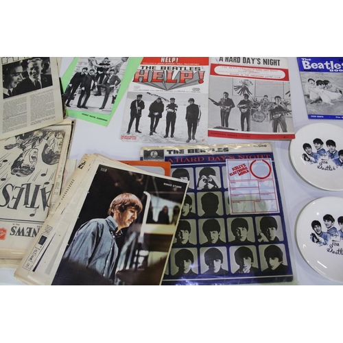 394 - Two side plates, featuring photos of the Beatles members, copy of a Hard Days night LP and other ass... 