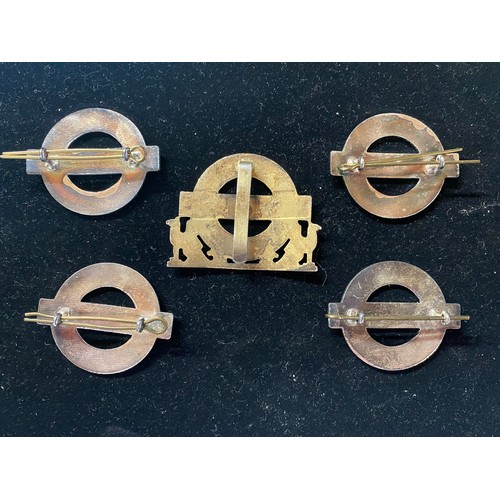 525 - London Underground enamel yellow metal surround cap badge W54mm, four London Underground cap badges ... 