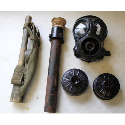 211 - Modern military items including military sight, British post war helmet, entrenching tool, flak jack... 