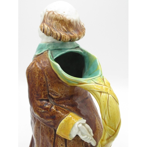 1255 - Victorian majolica jug in the form of an elderly cleric with scroll behind his back, H27.5cm, and a ... 